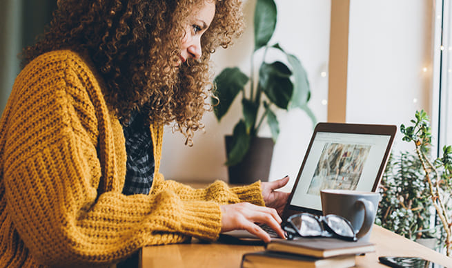 woman typing on laptop